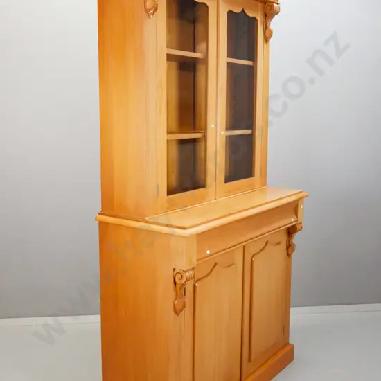 reproduction kauri colonial style bookcase chiffonier w/ shaped cornice, carved corbels, 2 shield shaped doors in base -