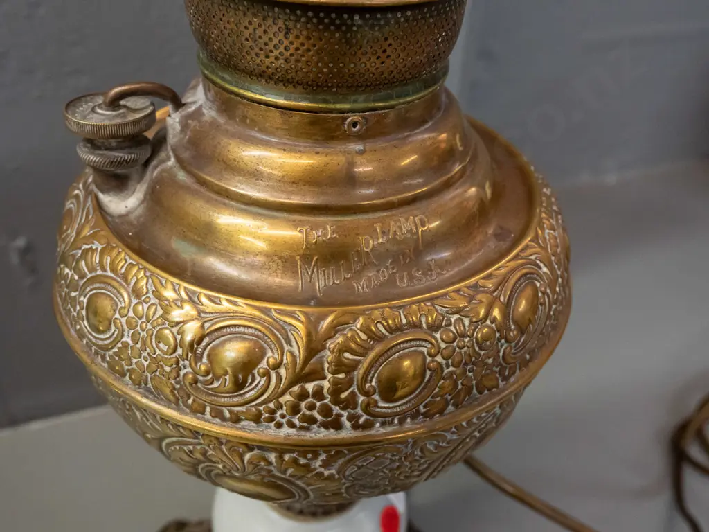 vintage Miller USA kerosene lamp with cast metal and ceramic base, converted to electric bulb, glass chimney sits loose Image 1++