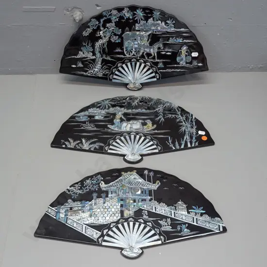 3 black laquer and mother of pearl fan-shaped wall hanging plaques H-235 W-420