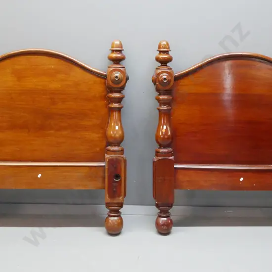 pair of colonial cedar single bed ends with shaped back, acorn shaped finials, turned supports on bun feet - original