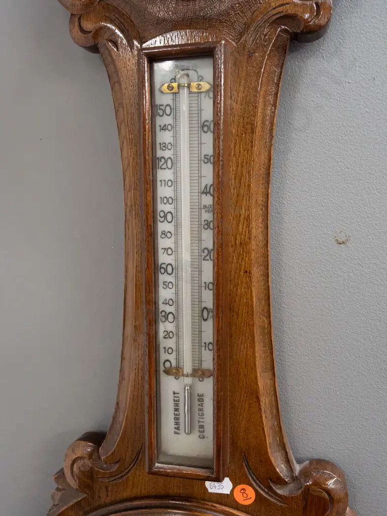 vintage oak-cased wall barometer-thermometer with porcelain faces & mercury filled thermometer in foliate carved case. Image 1++