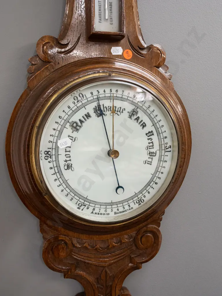 vintage oak-cased wall barometer-thermometer with porcelain faces & mercury filled thermometer in foliate carved case. Image 1++
