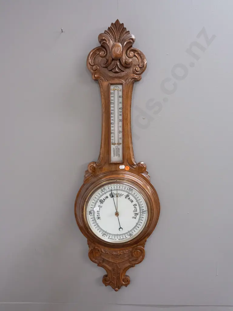 vintage oak-cased wall barometer-thermometer with porcelain faces & mercury filled thermometer in foliate carved case. Image 1++