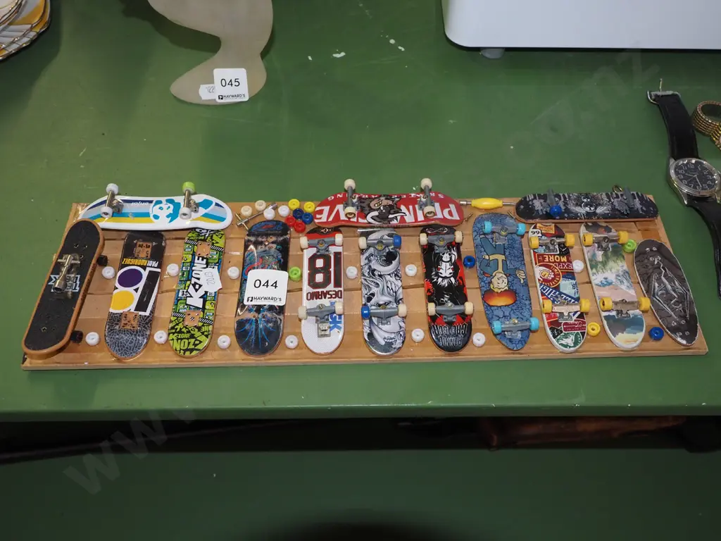 wall mounted mdf board of various finger skateboards Image 1++