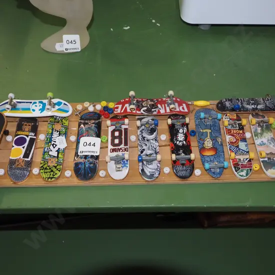 wall mounted mdf board of various finger skateboards