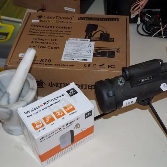 small spotting scope, mortar and pestle, wi-fi repeater, small boxed 3D printer 