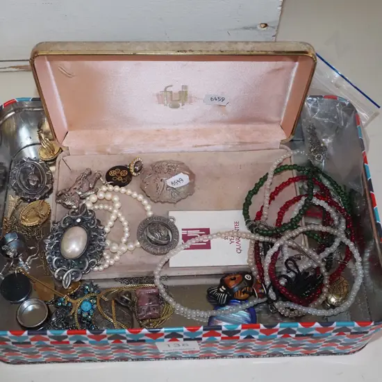 tin of costume jewellery