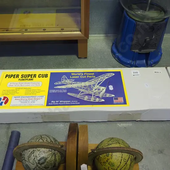 yet to be assembled wooden model of a Piper Super Cub float plane