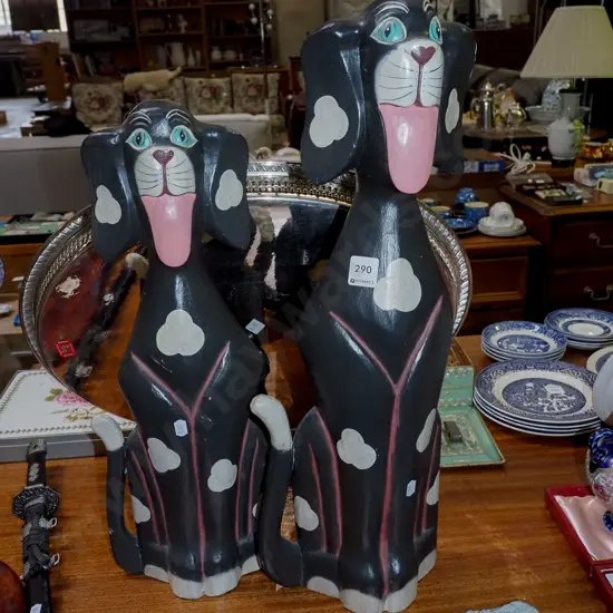 2x carved wooden dog figurines H600