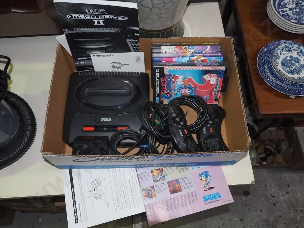box: Sega Mega Drive II with controllers and games Image 1++