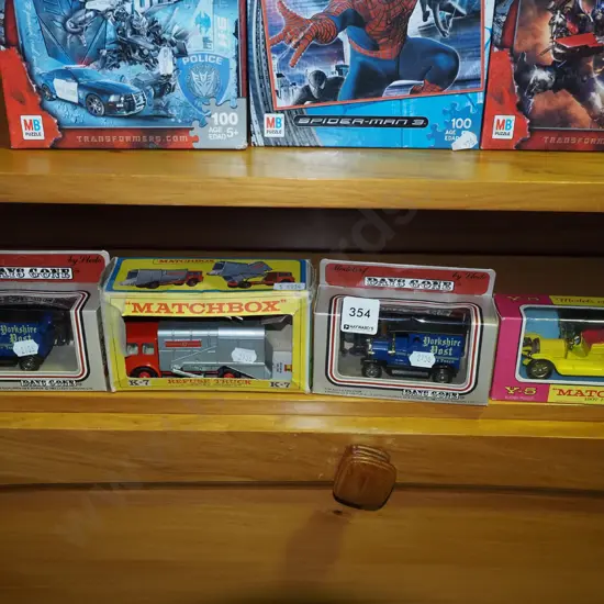 4 boxed model vehicles, one box damaged