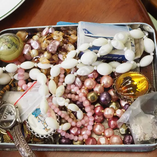 tin of costume jewellery