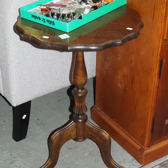brass footed faux mahogany wine table