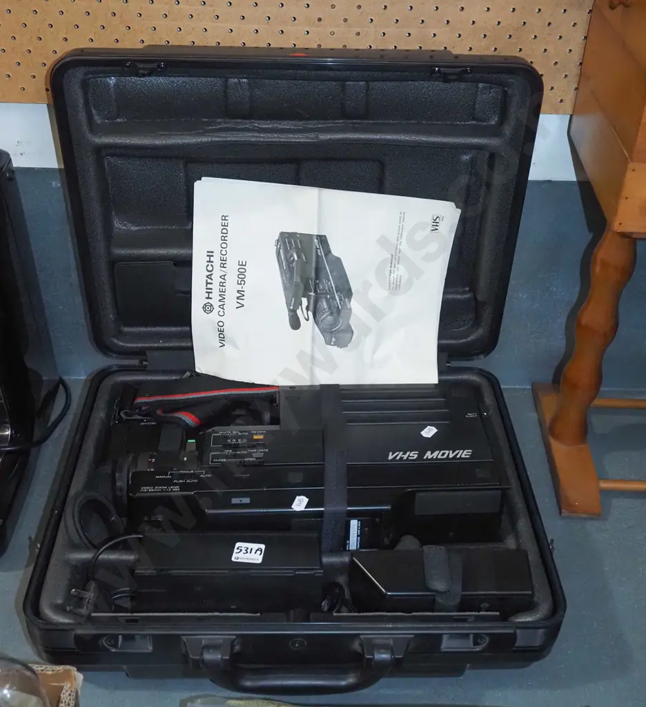 cased Hitachi VHS camcorder Image 1++