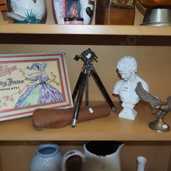 tripod, brass eagle figurine, chocolate box
