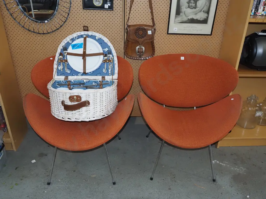 pair of orange upholstered fabric lip reception chairs Image 1++