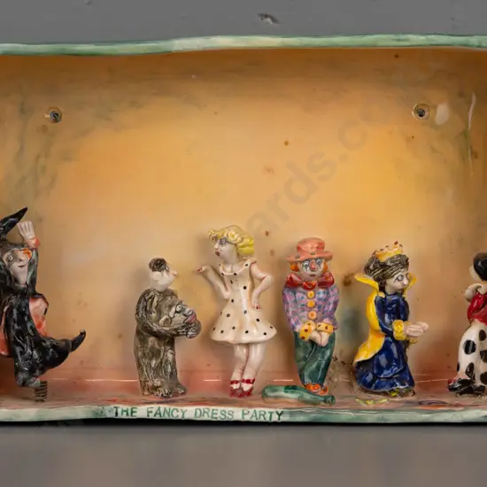 Marion Mewburn - ceramic diorama w/ 5 static figures and 1 figure mounted to spring, "The Fancy Dress Party"