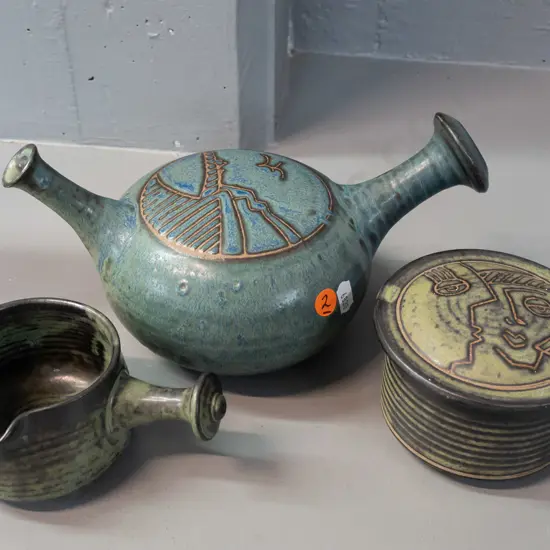 3 pieces of John Crawford New Zealand studio pottery - pouring vessel, lidded canister and small handled sauce/ramekin -