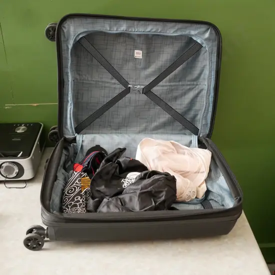 Black hard shell suitcase & various bags