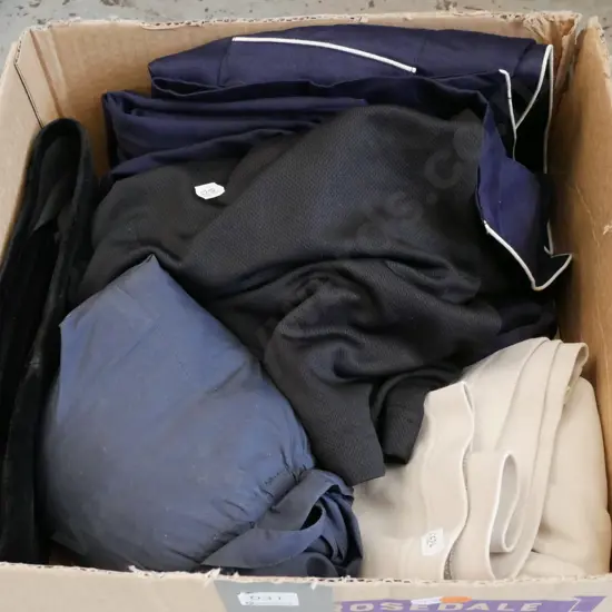 Cream T shirt, black tops,  pyjamas and rain ponchos