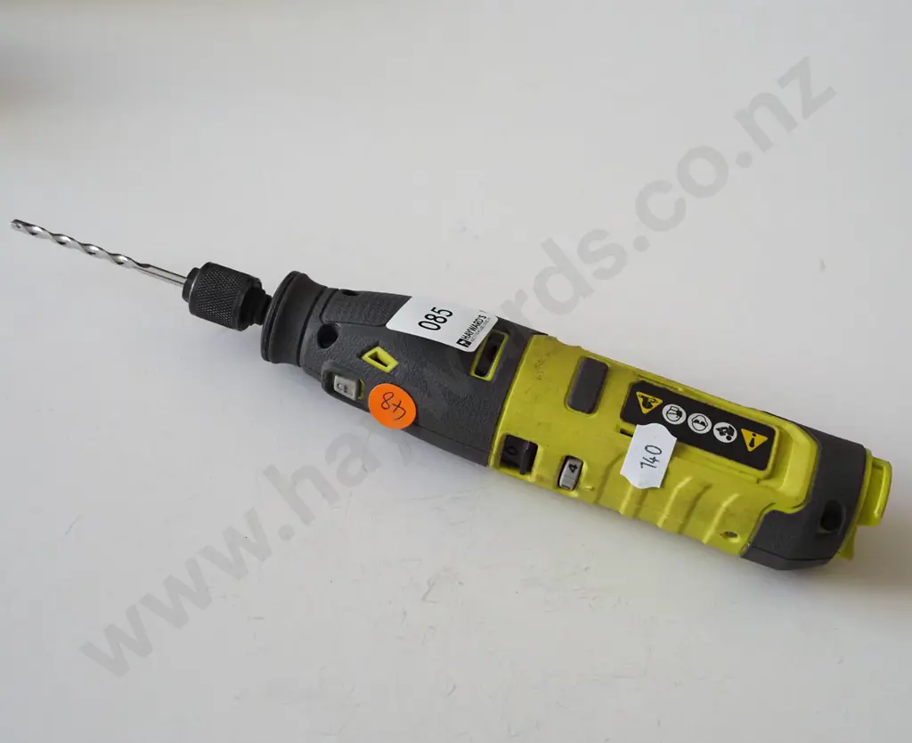 Ryobi black and green drill with drill bit Image 1++