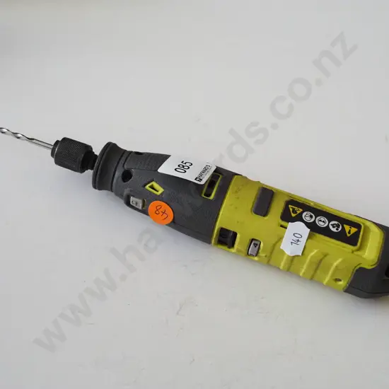 Ryobi black and green drill with drill bit
