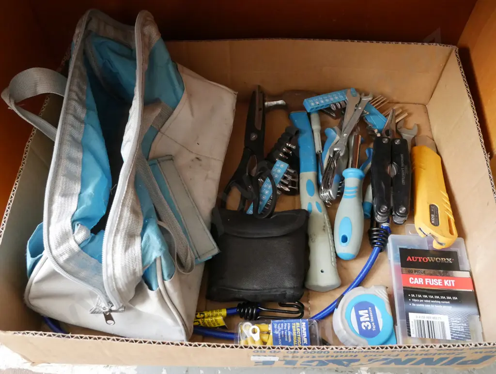 Blue Toolbag containing wires, pliers, hammer, multi tool, craft knife and other various tools and items. Image 1++