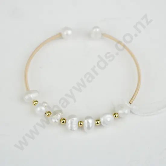 Gold open close bracelet with pearl beads and gold beads