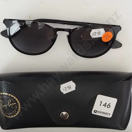 Pair of black Rayban sunglasses with case