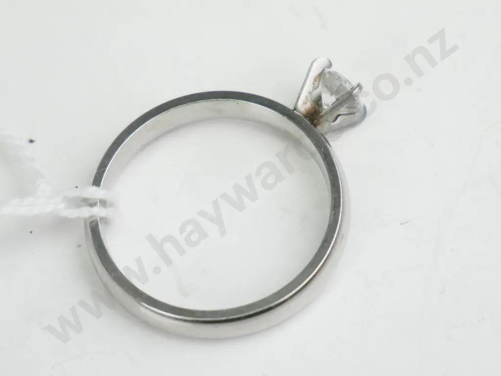 Silver coloured ring with single clear stone Image 1++