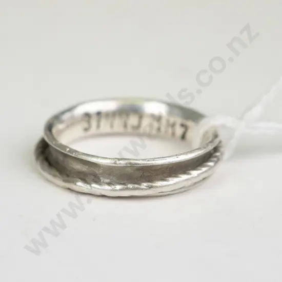 Silver ring with spinning parts, engraved inside with 31NNJMM7