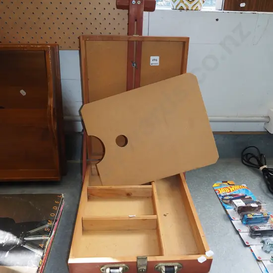 combination easel and supply box for artist