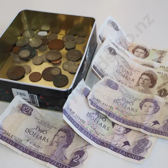 tin of bank notes and coins
