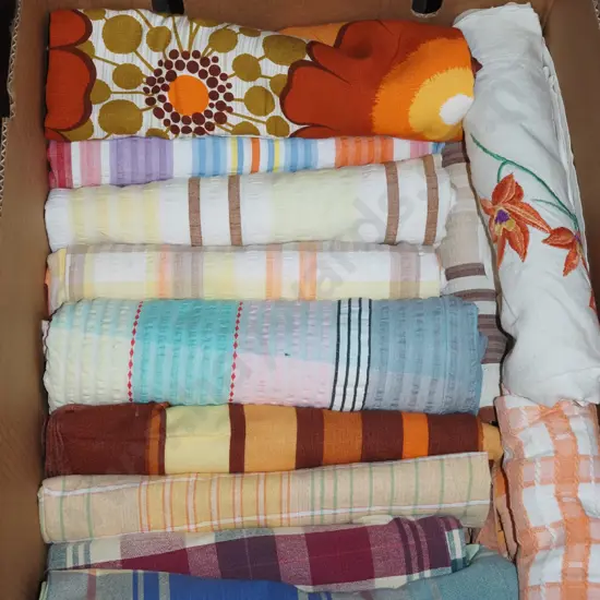 box of retro tablecloths