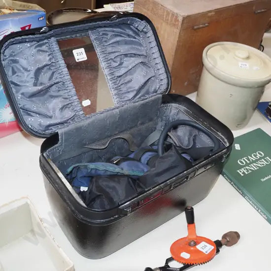 hard cased makeup box with various ankle weights etc