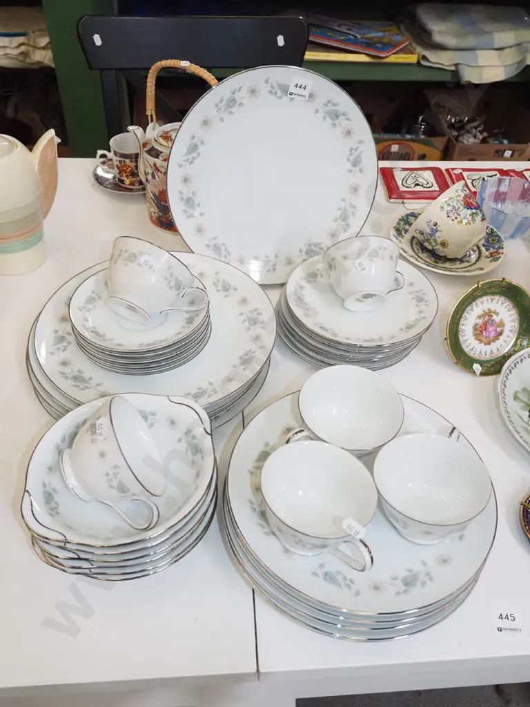 Noritake white and silver rimmed dinner items with floral patterning; plates, cups, bowls etc Image 1++