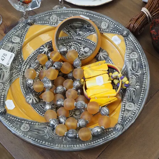 metal and ceramic pressed tin decorative bowl and costume jewellery