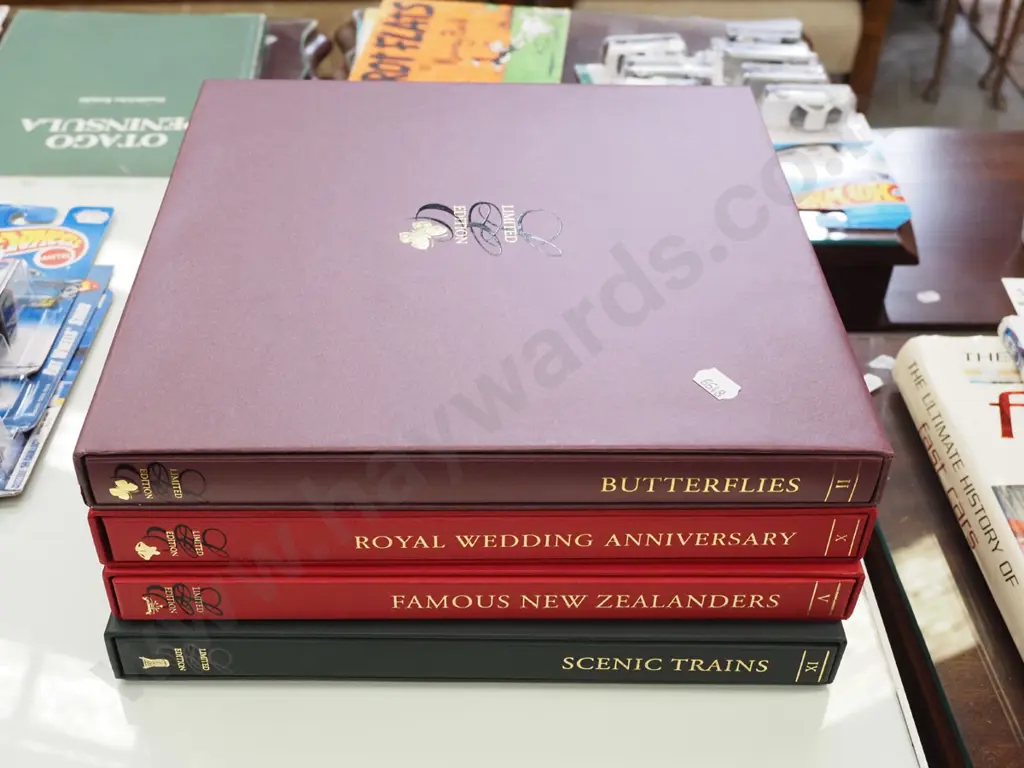 4 albums of collector stamp sets Image 1++