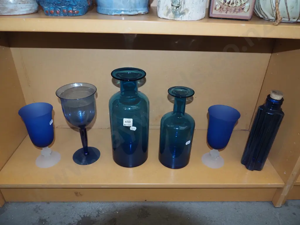 shelf; blue glass bottles, wine glasses Image 1++