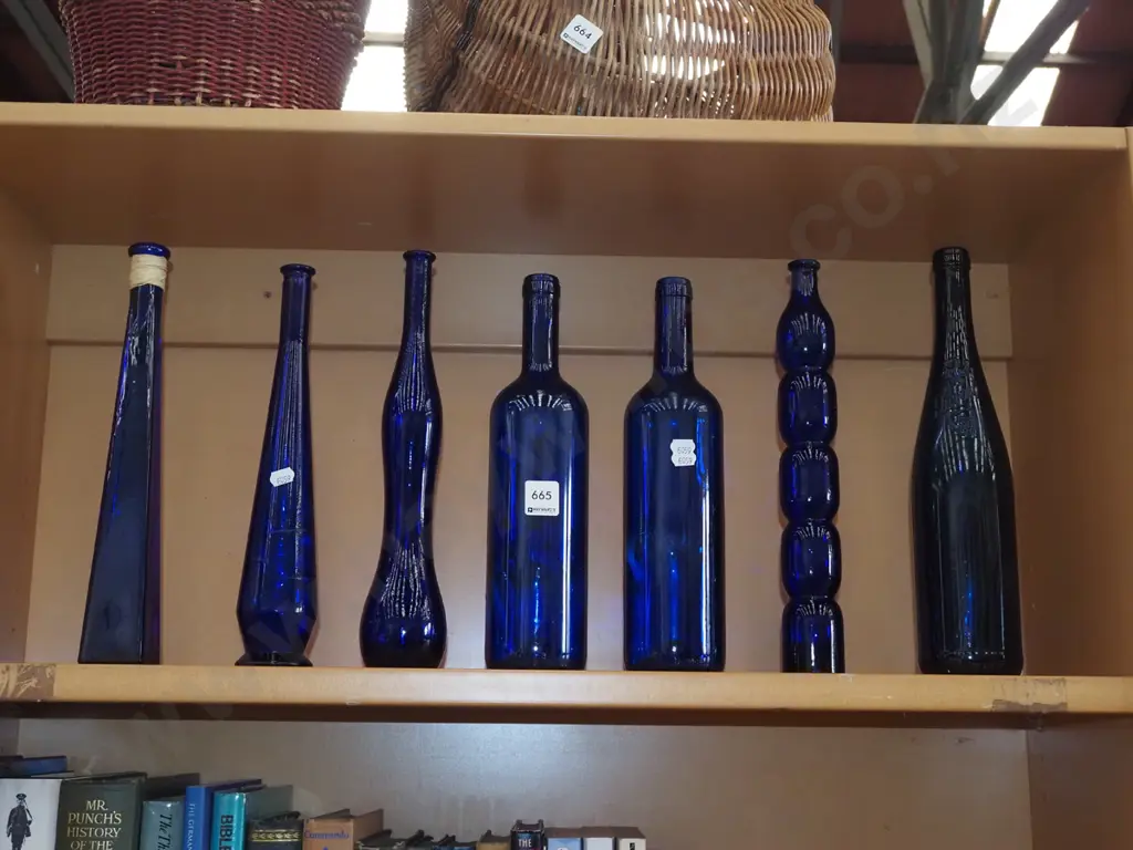 7x blue glass bottles H330 Image 1++