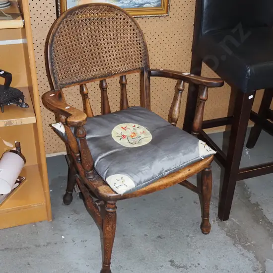 rattan and wood armchair and cushion - wear to rattan