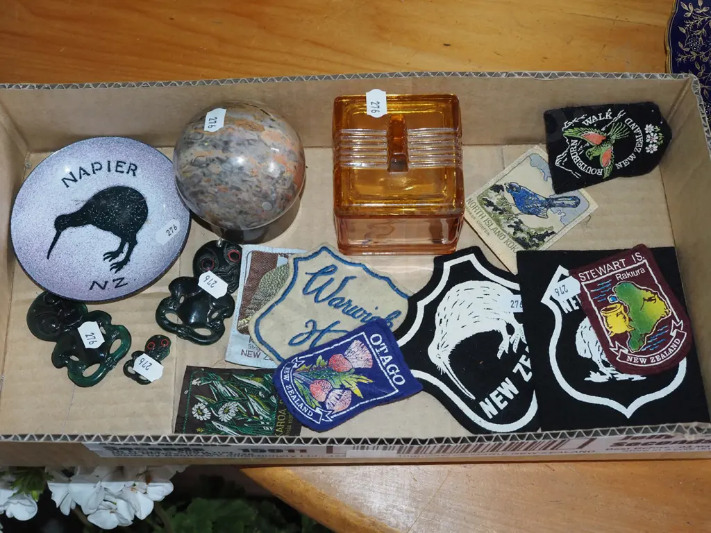 box; plastic tikis, enamel ashtray, NZ badges etc Image 1++