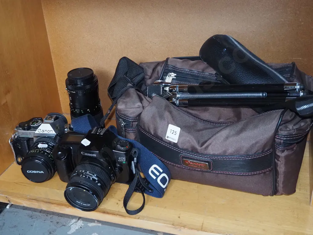 Canon AE-1 and Canon EOS 1000F 35mm SLR film cameras, additional lens, tripod & carry bag Image 1++