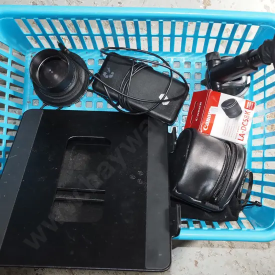 plastic basket; camera lens, external hard-drive, tablet stand etc