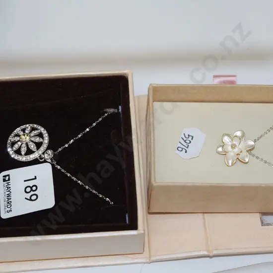 2x flower themed necklaces