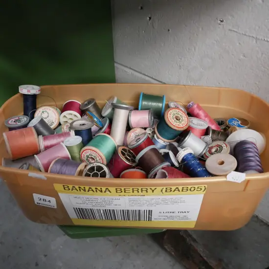 tub of sewing threads