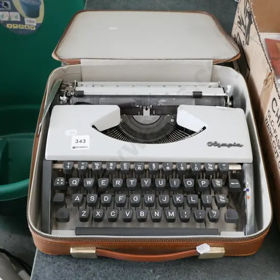 cased Olympia portable typewriter