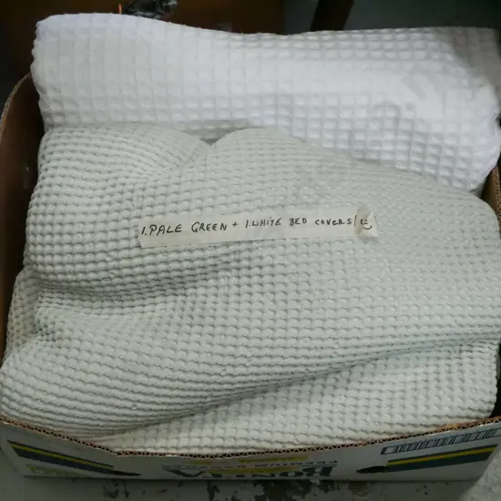 pale green and white cotton bedcovers