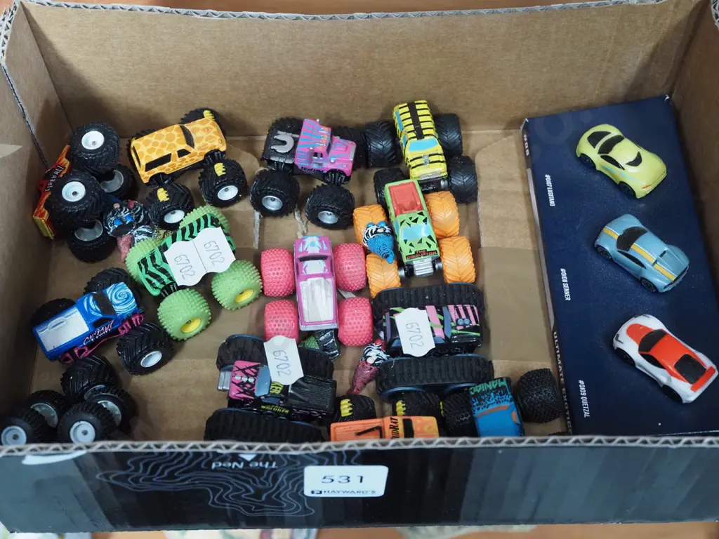 box of miniature monster trucks and cars Image 1++