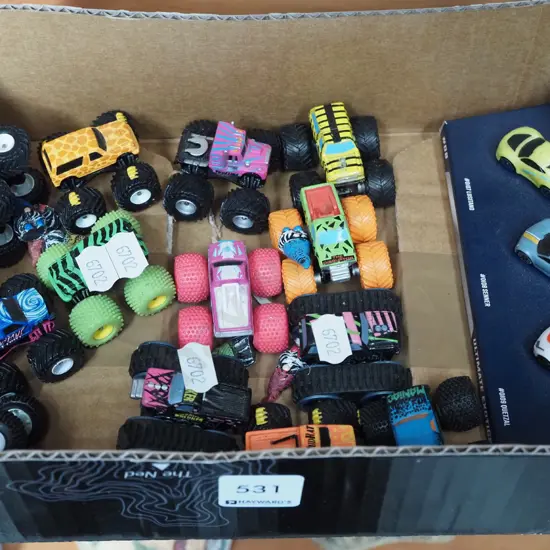 box of miniature monster trucks and cars